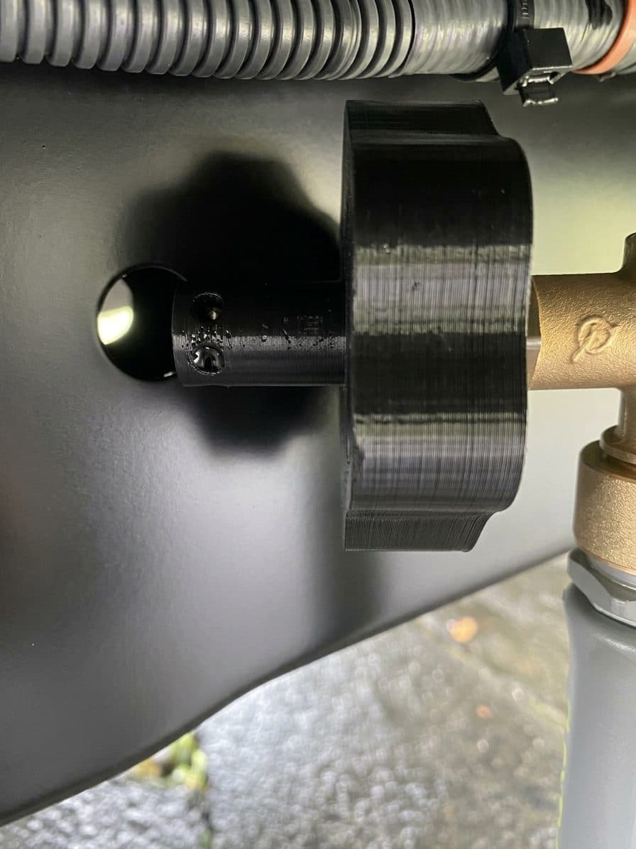 Nozzle seated in a frame hole